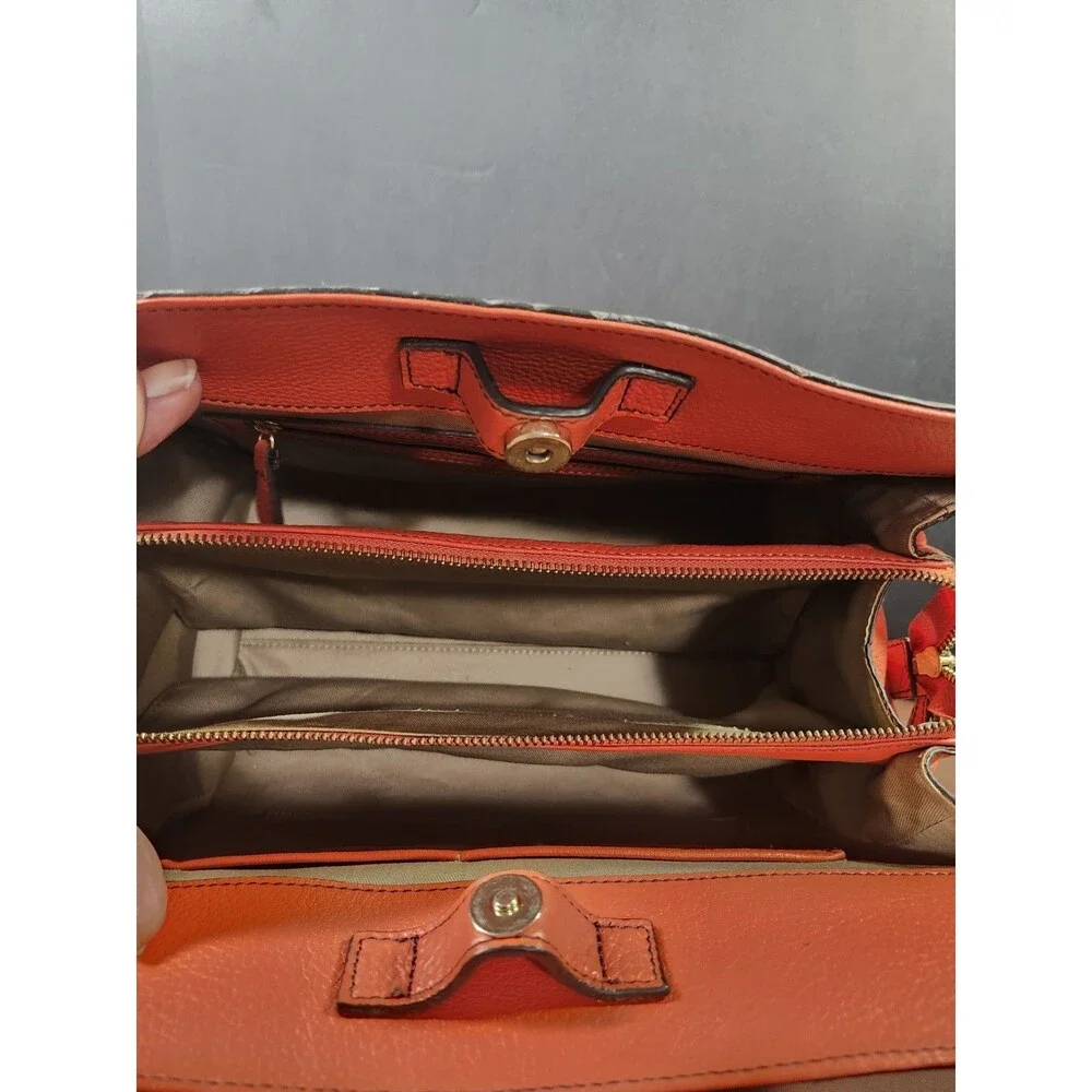 orange pebbled leather top-handle satchel bag by Isaac Mizrahi.